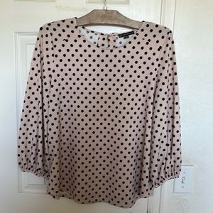 Dust pink and black polka-dot blouse.